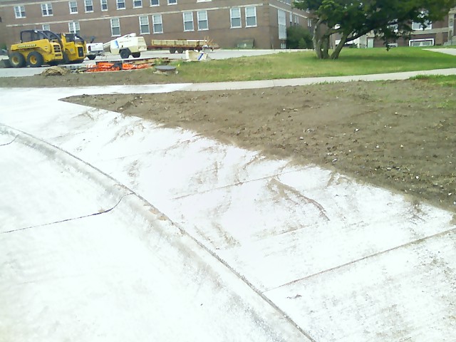 Erosioin mud flow across sidewalk